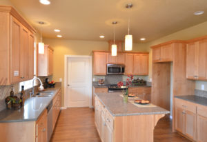 Warm kitchen update with counter top dining area.