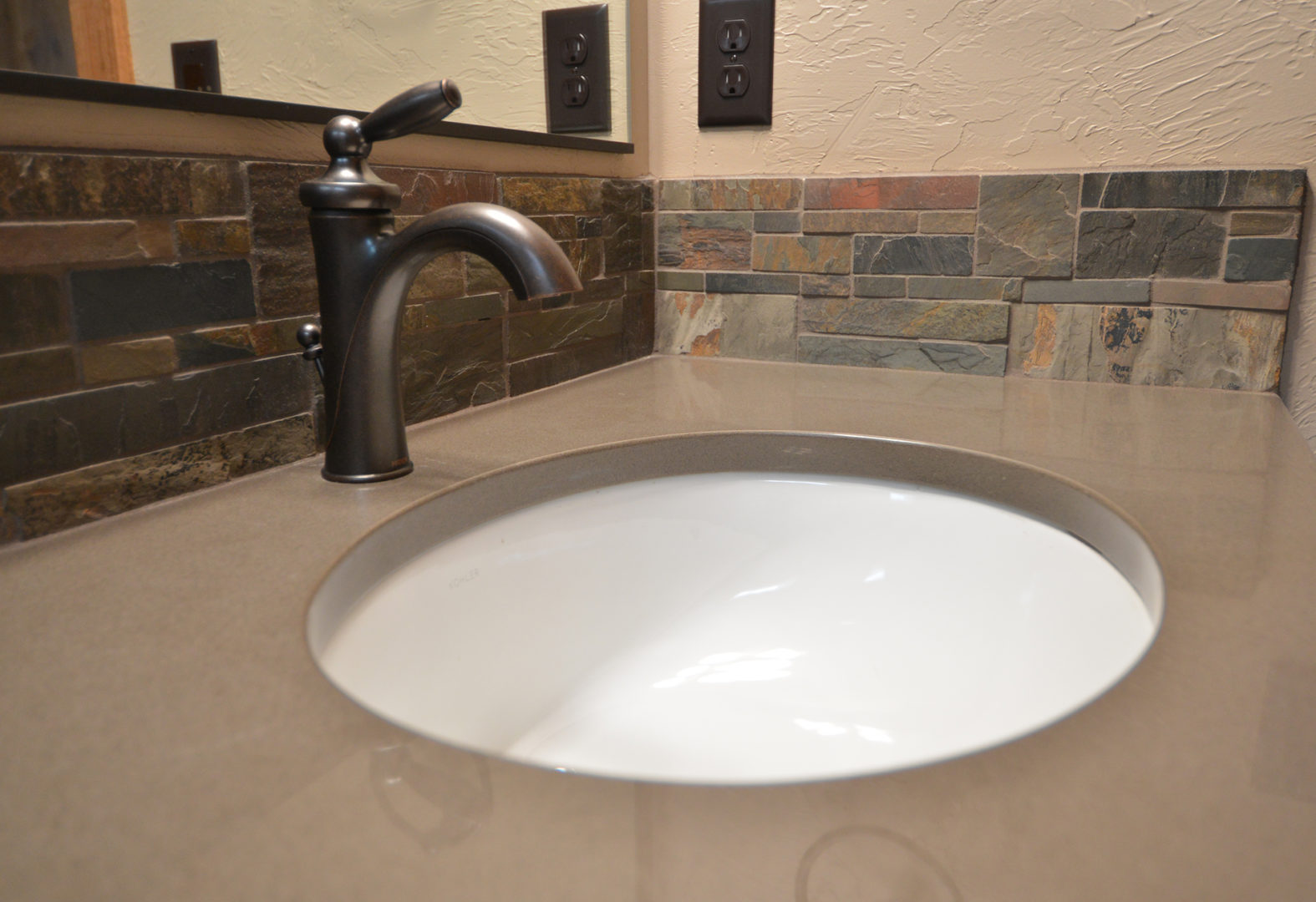 Round under mount bathroom sink. Masculine and sleek.