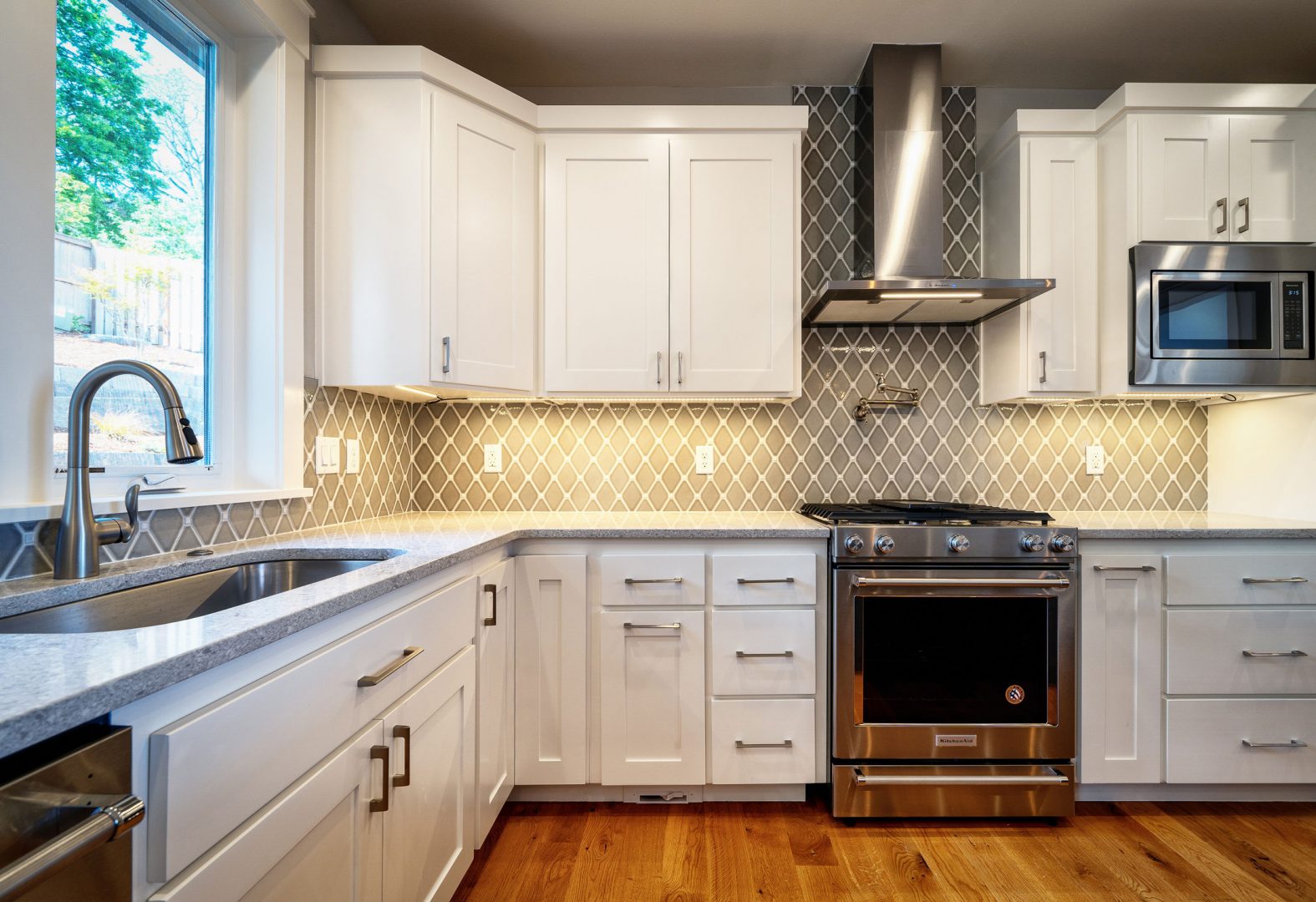 Updated kitchen with lighting under cabinets.
