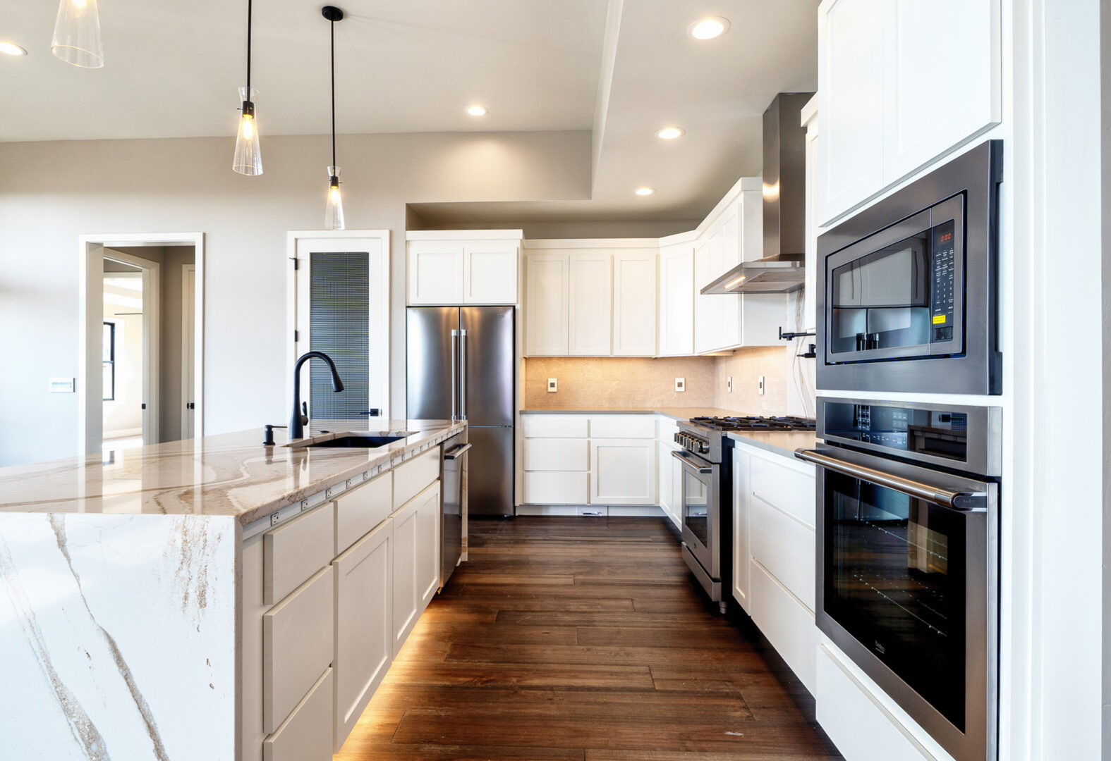 Kitchen appliances include wall ovens for easy accessibility.