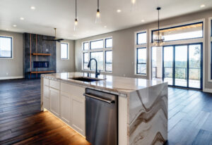 Open and spacious floor plan with kitchen sink facing out into great room.